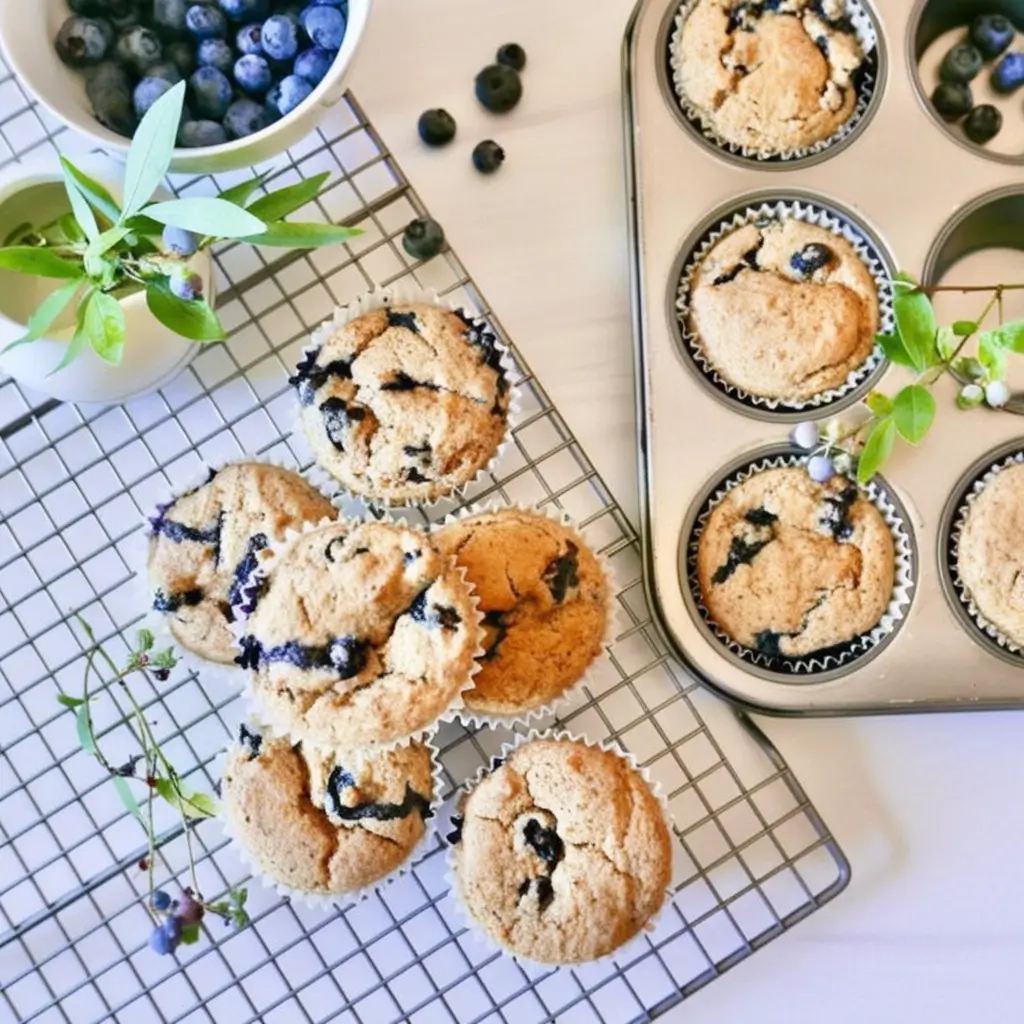 Blueberry pastries with a bowl of fresh blueberries.